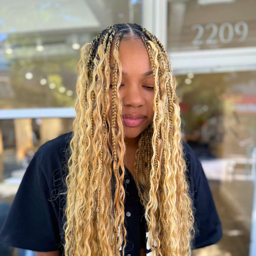 Diverse group of women standing together, each with different curly protective hairstyles, highlighting natural hair inclusivity