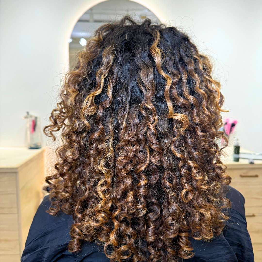 Curly hair transformation showing healthy, bouncy curls