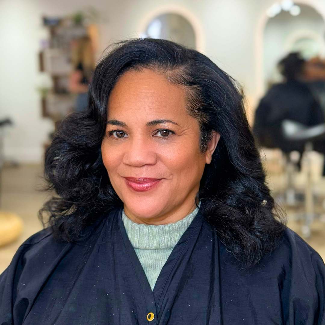 Silk press technique on coarse natural hair for a smooth, frizz-free finish.