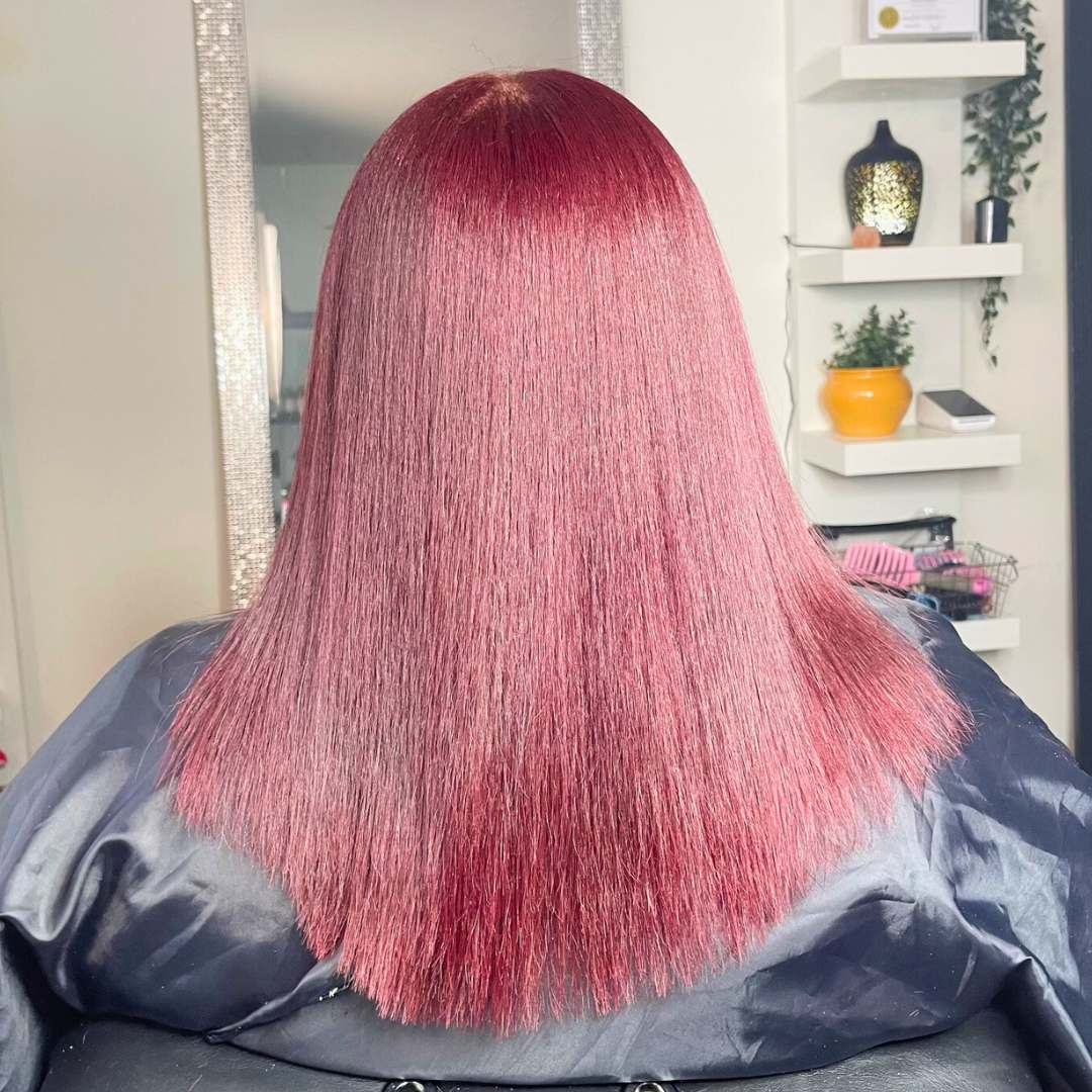 ealthy, shiny hair after silk press treatment for natural curls.