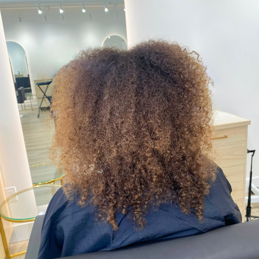 Hair spa and curl care banner promoting natural hair treatment at Descurl Spa Salon