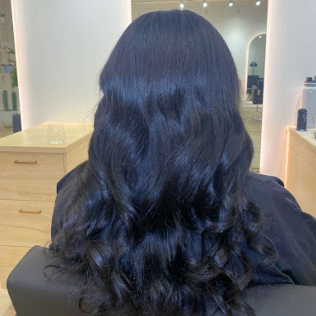 Curly hair seamlessly blended with luxury extensions