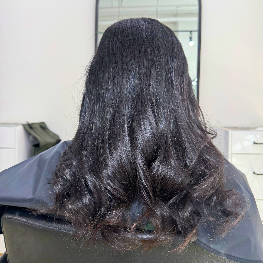 After silk press results with sleek, straight hair and a polished finish.
