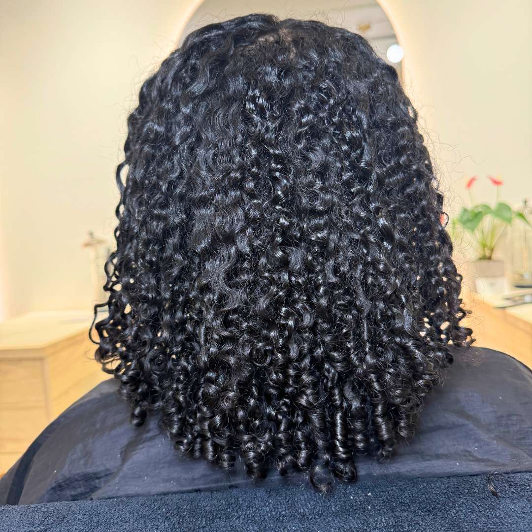 Before curly haircut image highlighting hair volume and density