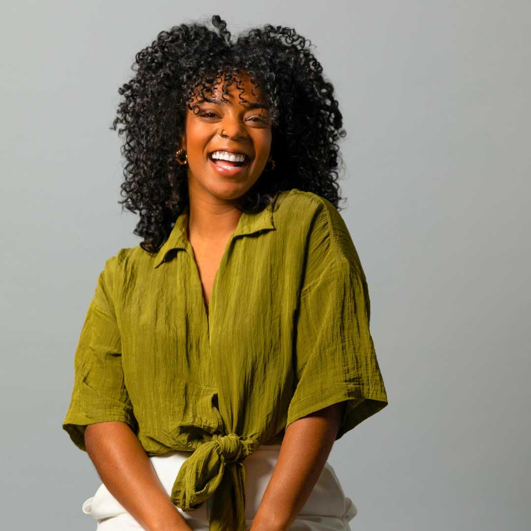 Destini curl specialist portrait showcasing healthy, defined curls and expert curly hair shaping