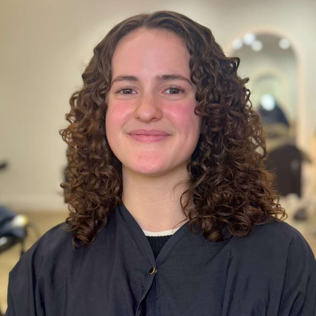 Nourishing scalp serum being applied to support healthy hair growth.