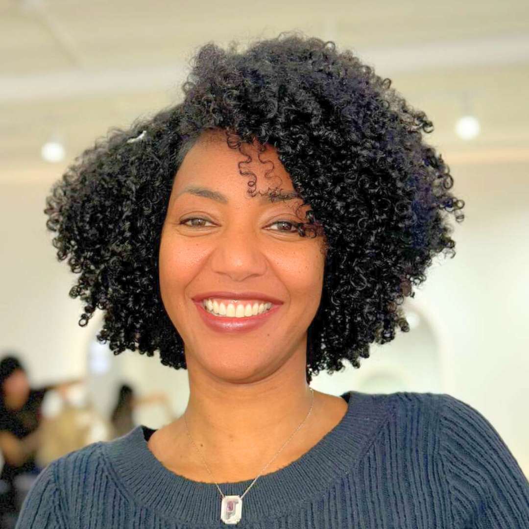 Curly hair salon style featuring defined natural curls