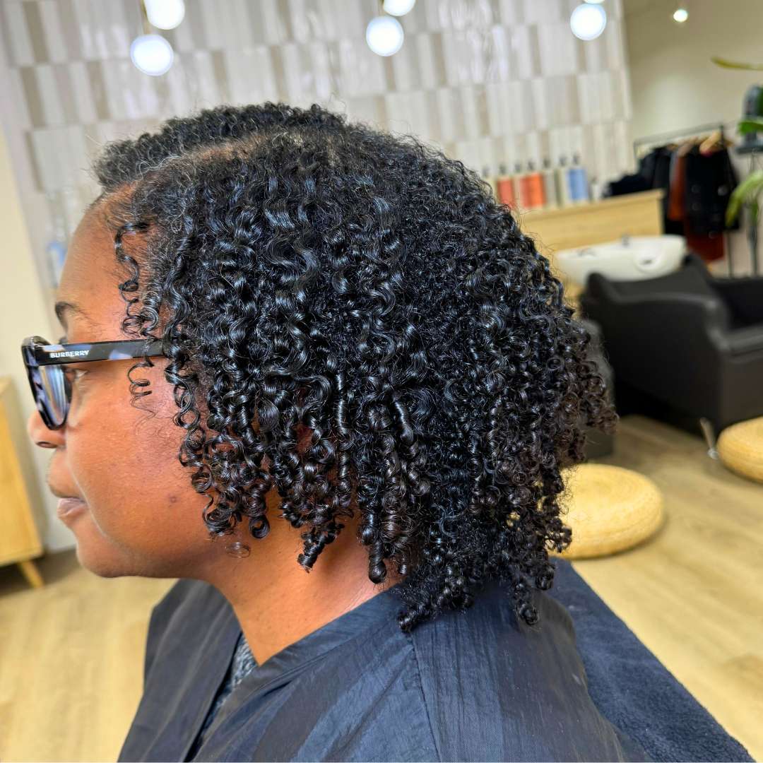 Before and after curly hair transformation at Descurl Spa