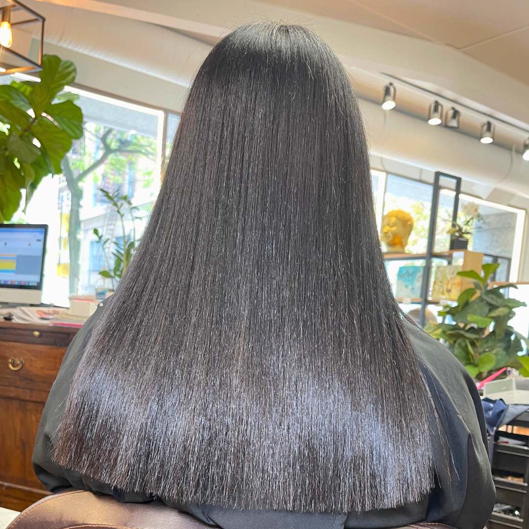 Smooth and voluminous results from a silk press at DesCurl Spa Salon.