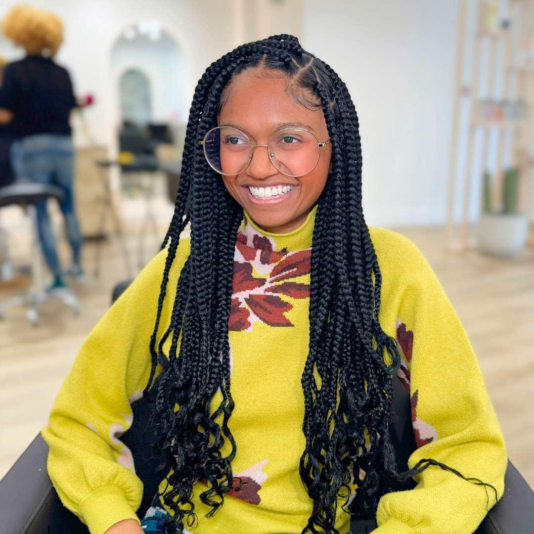 Close-up of defined spiral curls after silk press treatment—healthy, smooth, and frizz‑free from curl care specialists