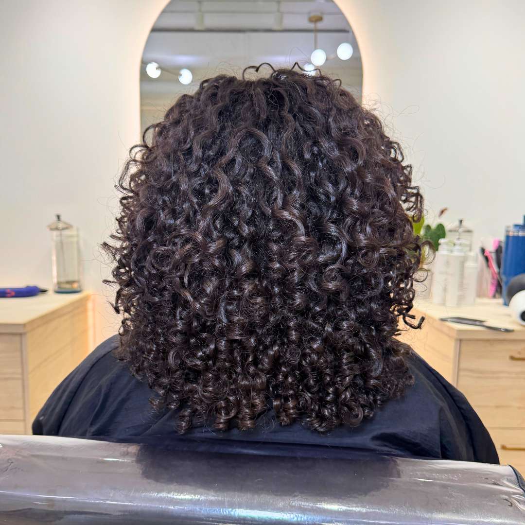 After styling: enhanced, defined curls with smooth finish