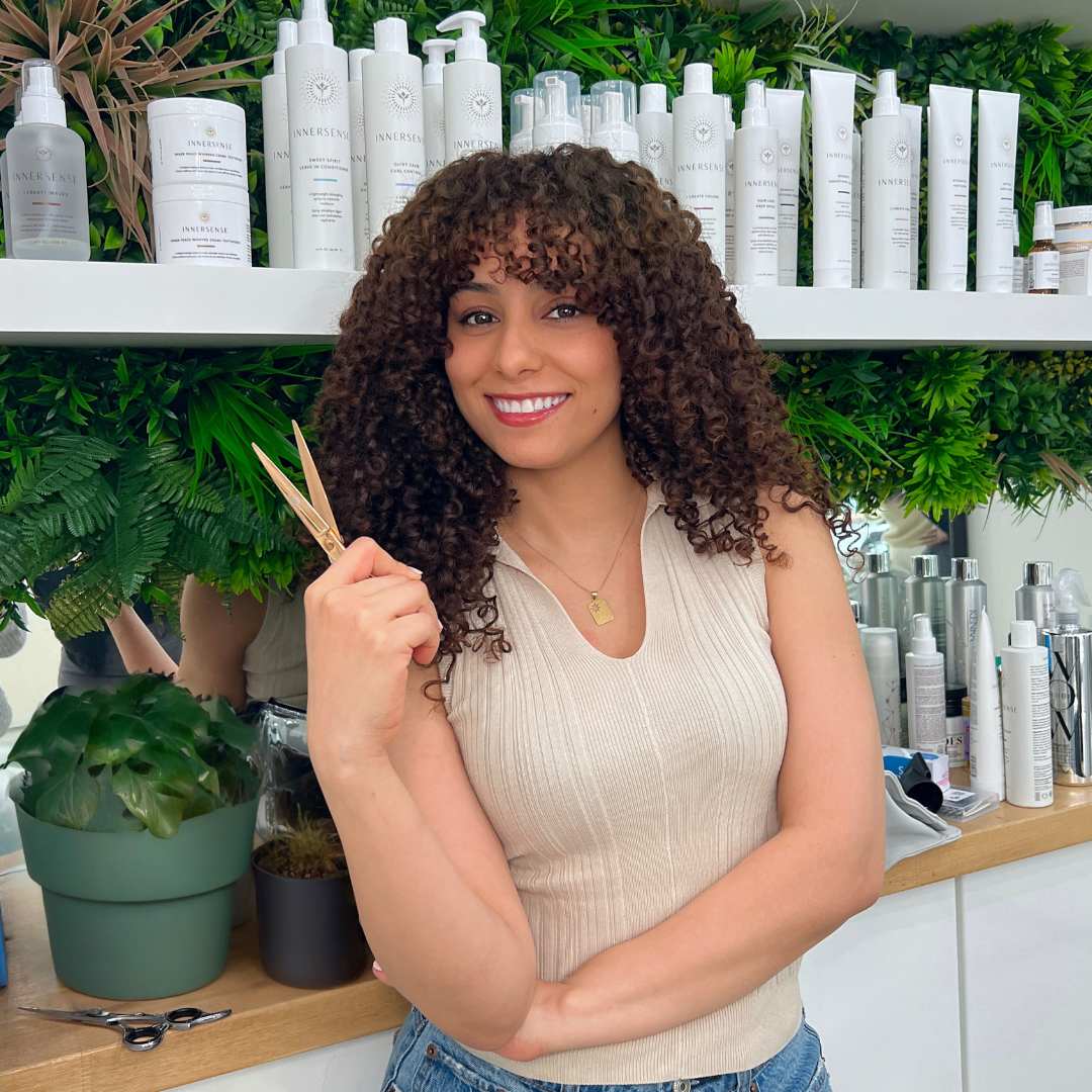 Vancouver curly hairstylist showcasing defined natural curls after professional cut and style