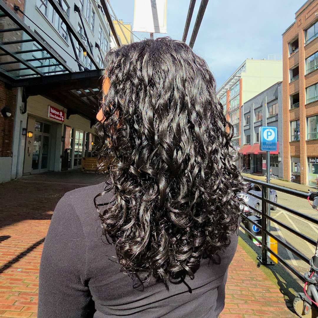 Curly hairstyle with volume and definition styled at Vancouver's Destini Curl Spa Salon