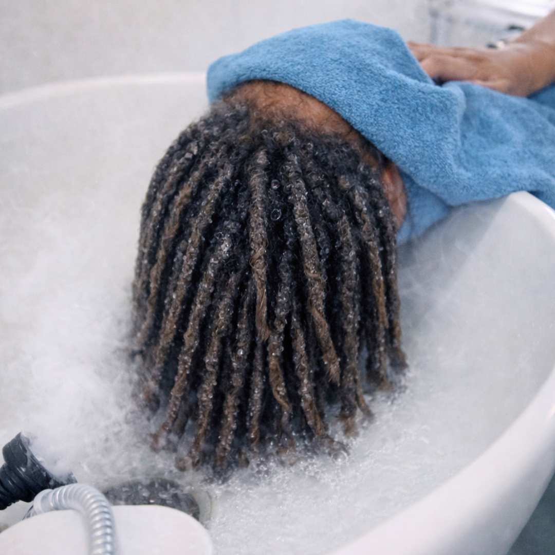 <p>Our signature steam opens the cuticle and deeply hydrates, making locs pliable for safe manipulation.</p>