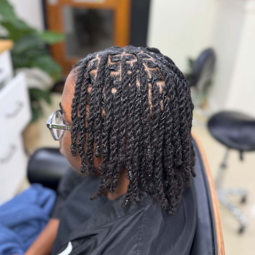 Neatly twisted short locs with clean parts and defined sections — DES Curl Spa loc retwist service Vancouver