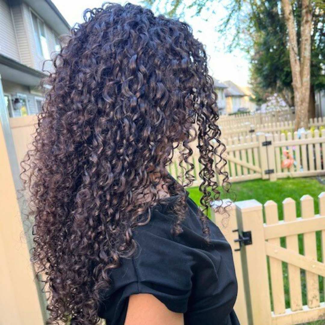 Styling curly hair with volume-enhancing techniques for defined, frizz-free curls