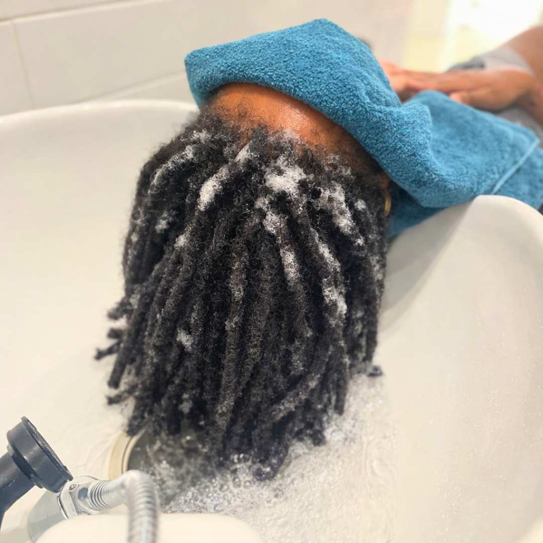 <p>Residue-free shampoo applied twice to fully remove buildup from locs and scalp</p>